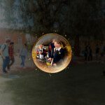 Abstract sphere with reflection of students