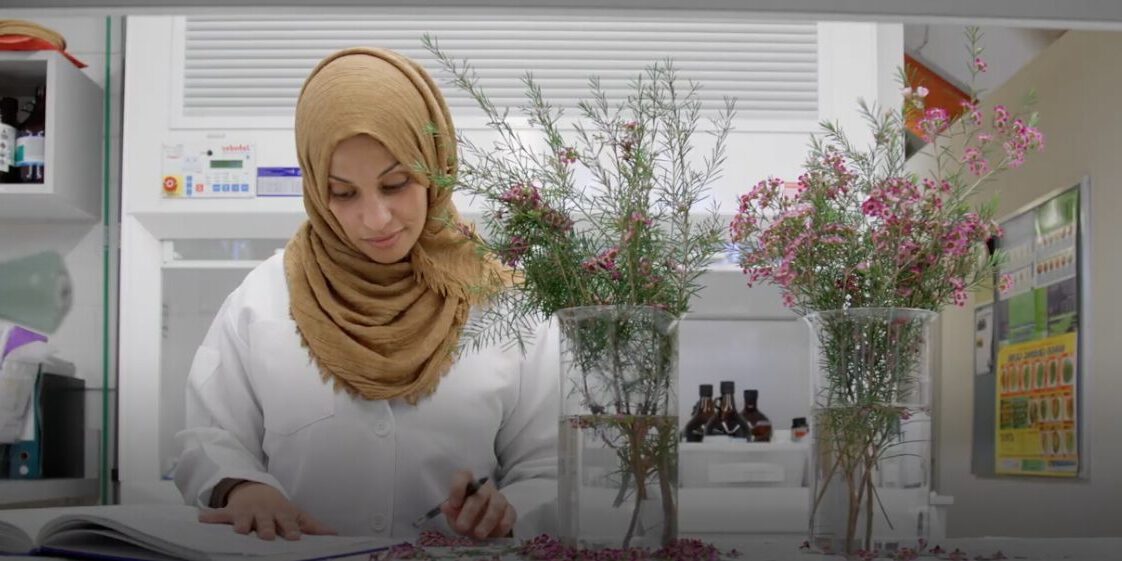 Female student in lab studying Australian native flora - play video