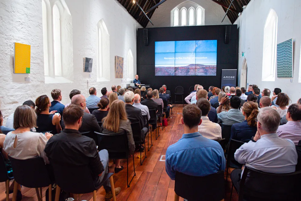 People sitting in conference in 139 St Georges Tce