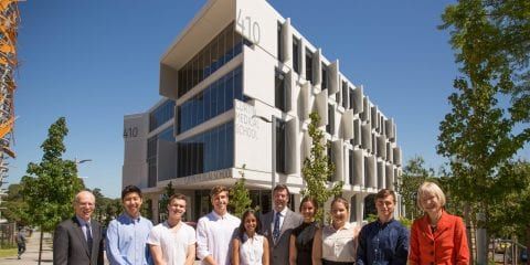 Staff standing out the front of the Curtin medical campus