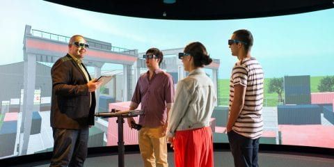 A group of students standing in the HIVE