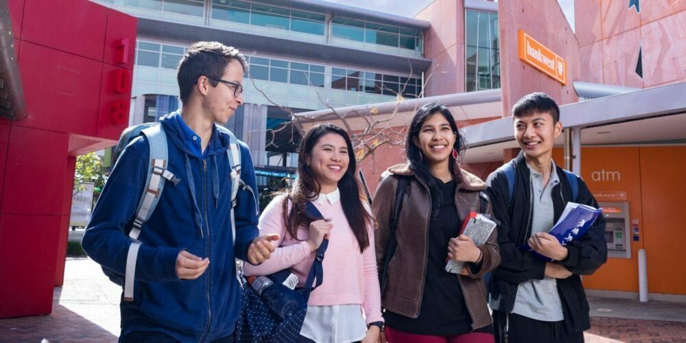 Students walking near Business and Law facilities