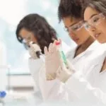 3 female students working in a lab