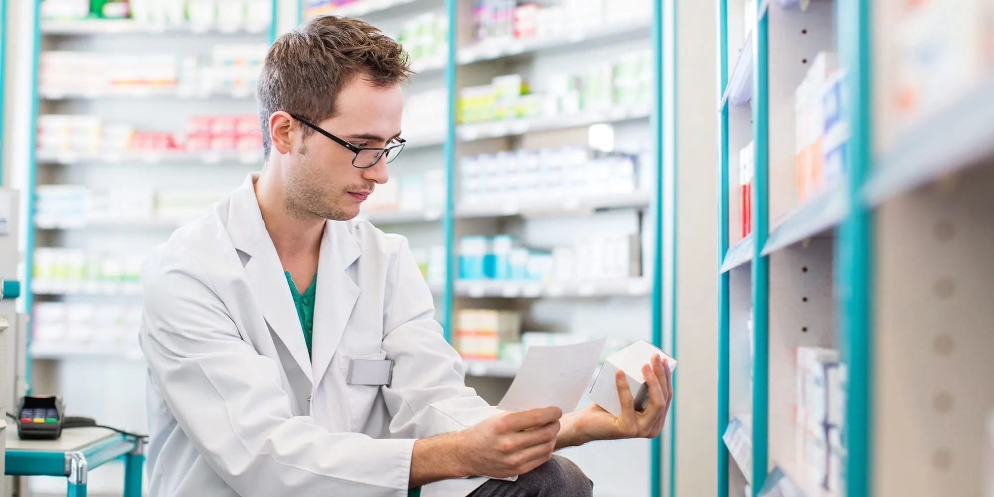 Pharmacy student looking at medications