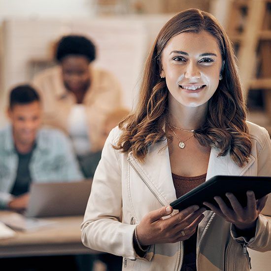 business woman holding up a computer tablet