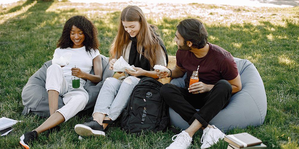 Students eating on lawn