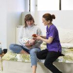 Mother and baby with midwife