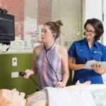 Student nurse and supervisor examining patient at Curtin Medical School