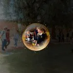 Abstract sphere with reflection of students