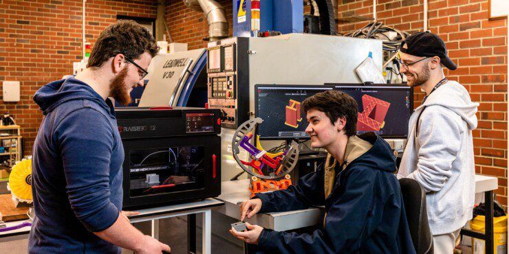 Mechanical engineering students working on a project