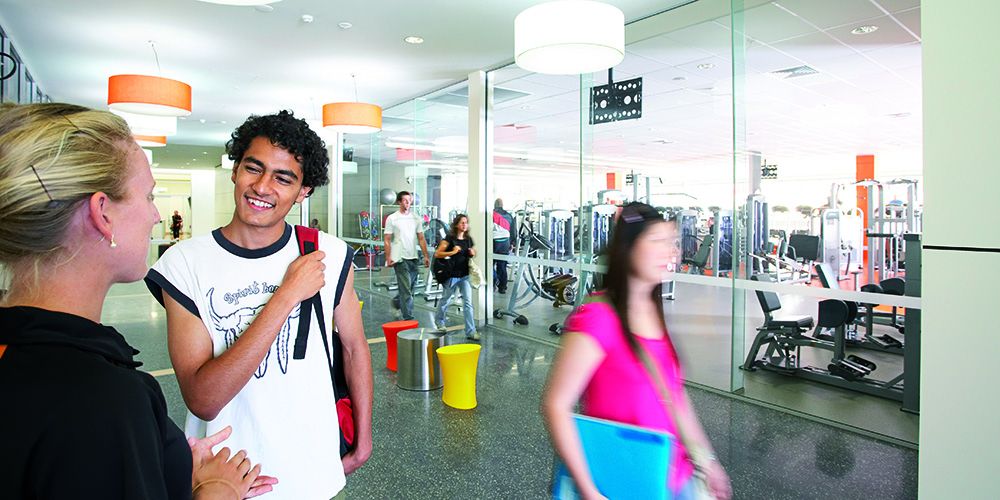 A male talking to a female member of staff in the Curtin Stadium - play video