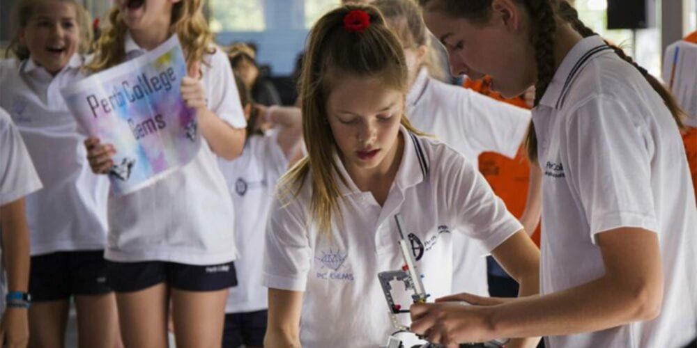Female students building with lego
