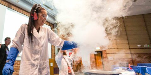STEM outreach student conducting experiment with dry ice