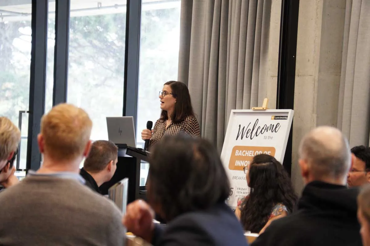 Image of guest presenter addressing the audience