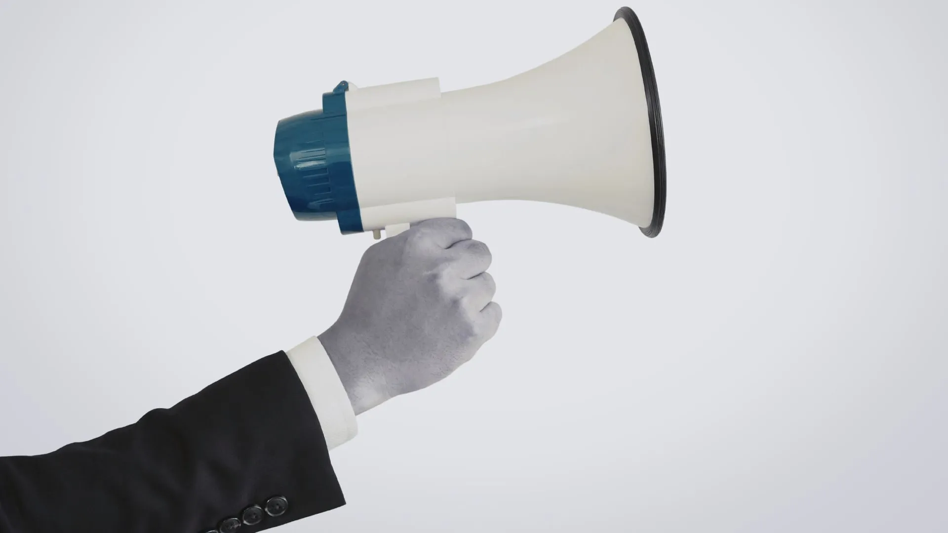 A person in a suit holding a megaphone, representing communication, promotion, or broadcasting a message.