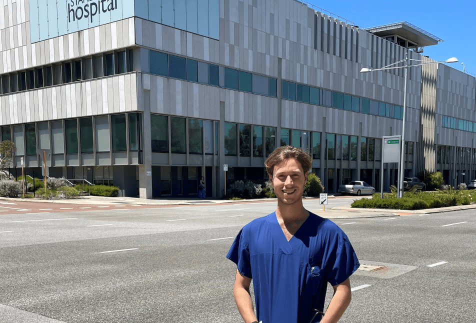 Curtin graduate James Leigh in scrubs