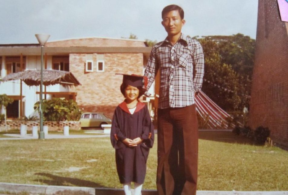 A young Sandy Chong with her father