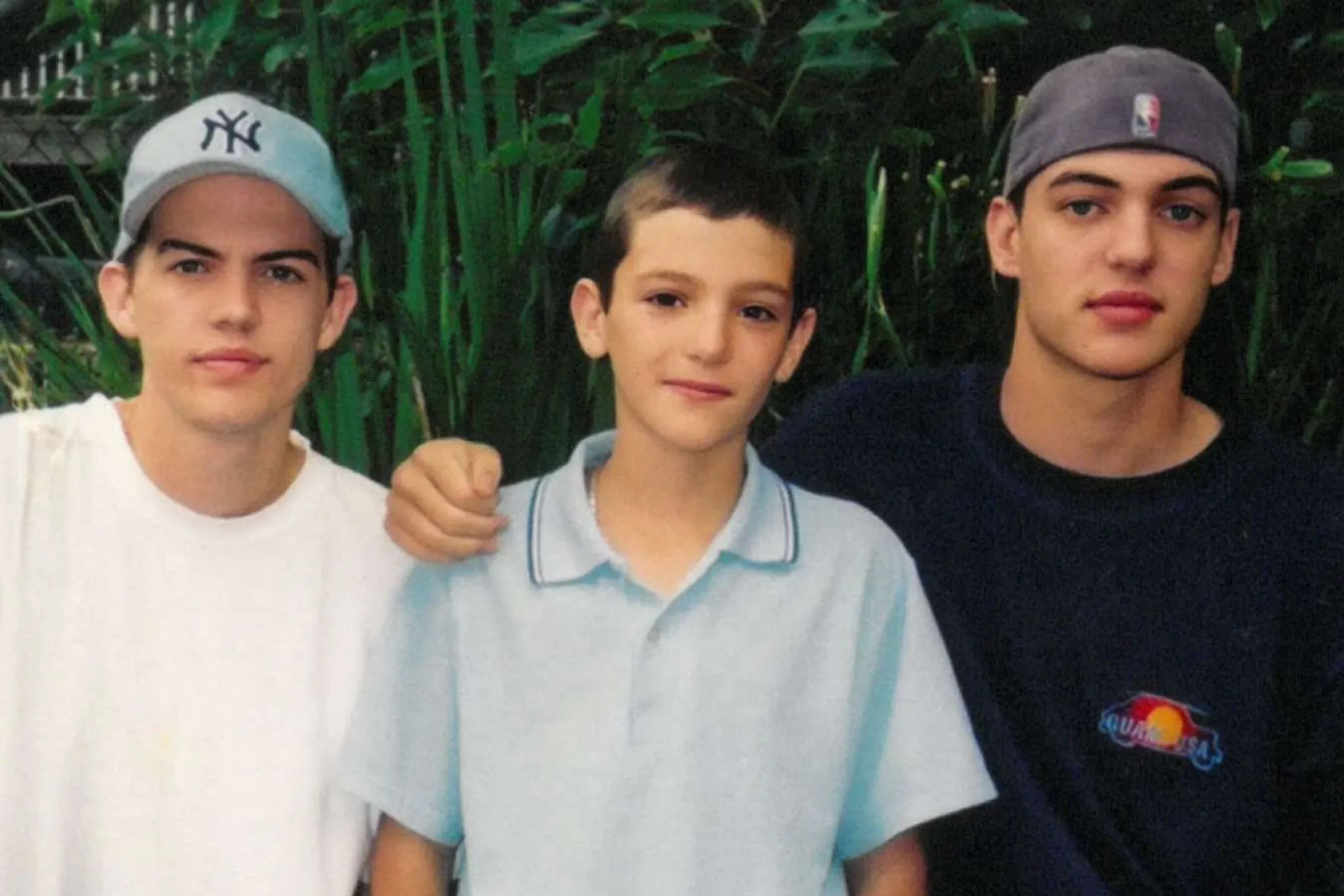 a young matt, dan and nate standing together