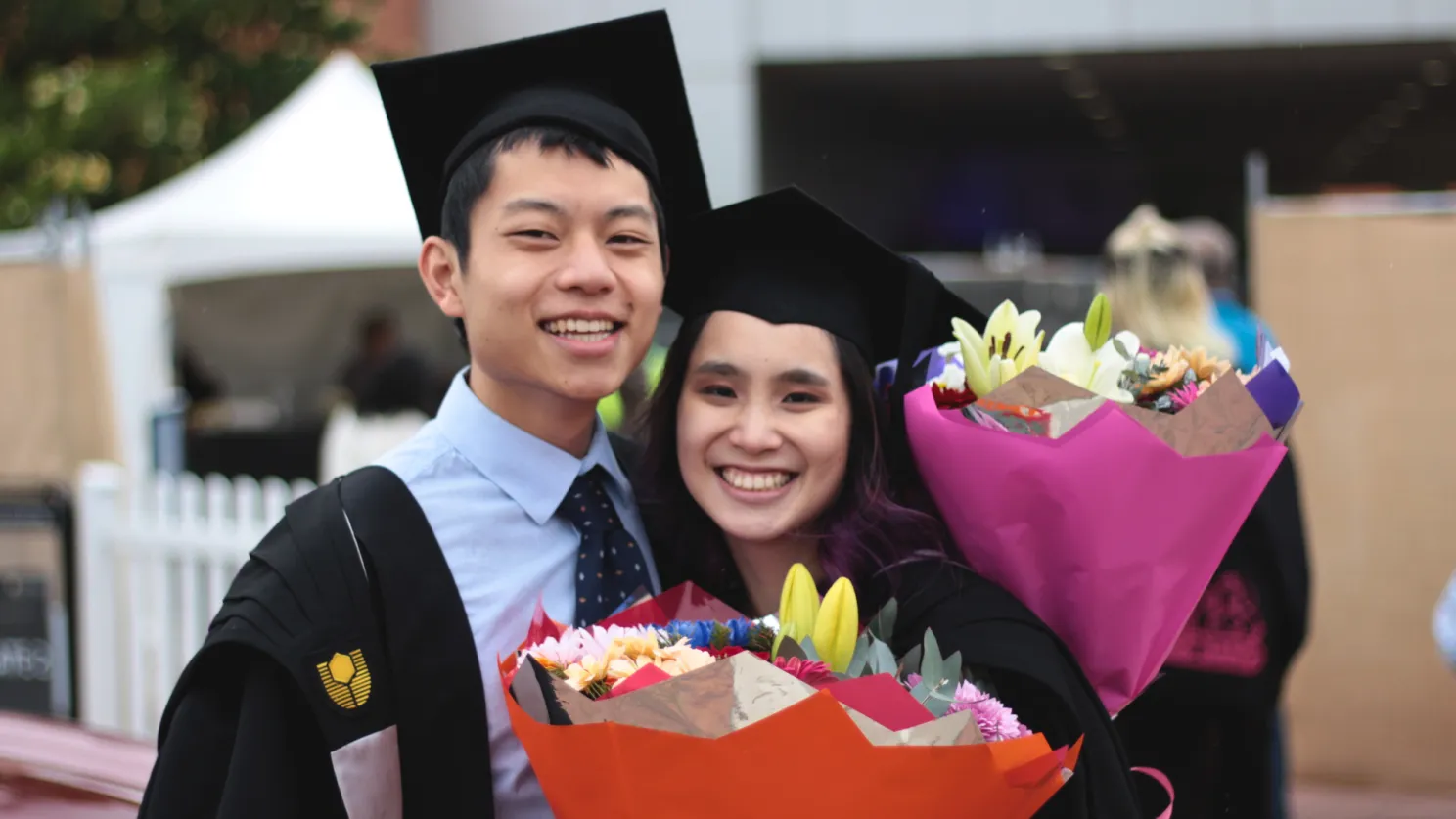 curtin medical school graduate chris chi and his wife at graduation.