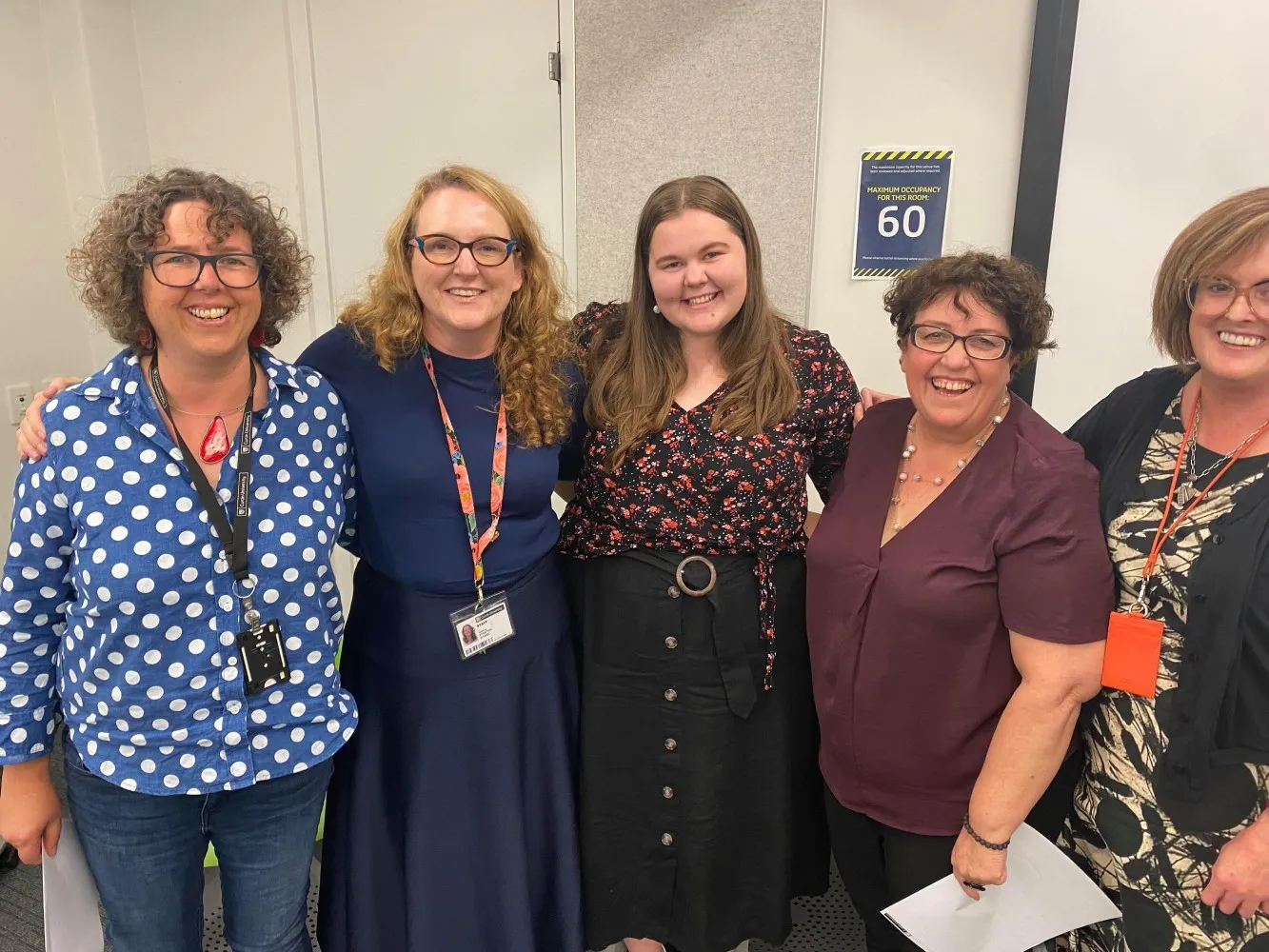 curtin social work graduate ellecha thorp with curtin staff