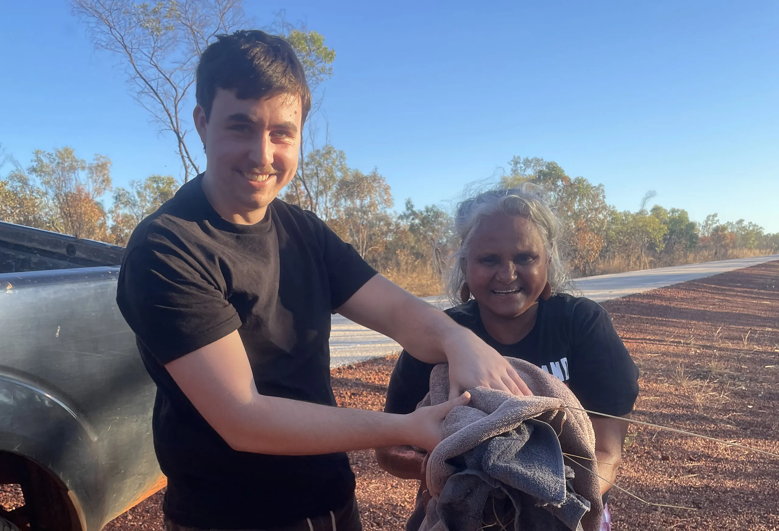 curtin graphic design graduate will peucker and aunty saving a pelican on country