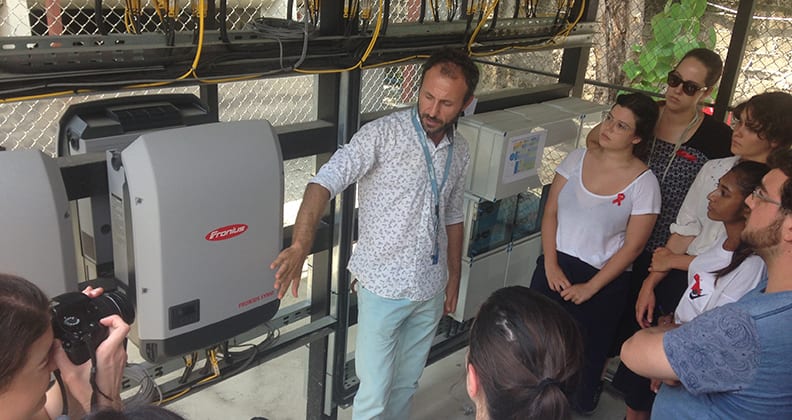 Ismail Inan, project manager for Solar Energy System, shows students how the solar systems work. 