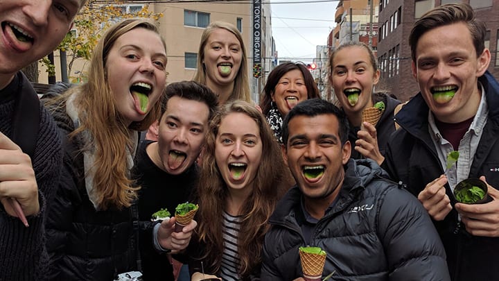 tour group with green matcha tongues