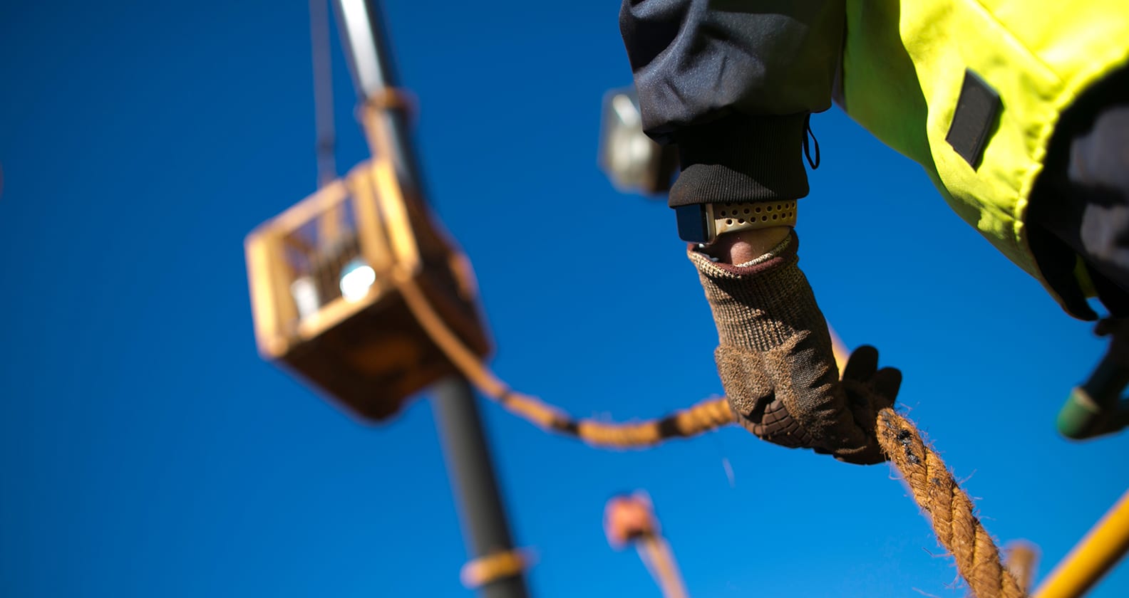 Rigger positioning a crane load.