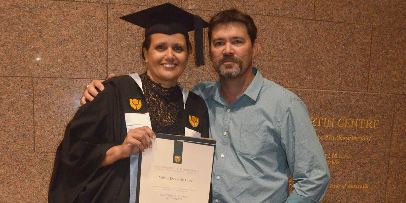 Valerie Ah Chee with husband Brendon Snr. posing after graduation.