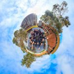 A 360º photo of the Student Ambassadors with their hands up