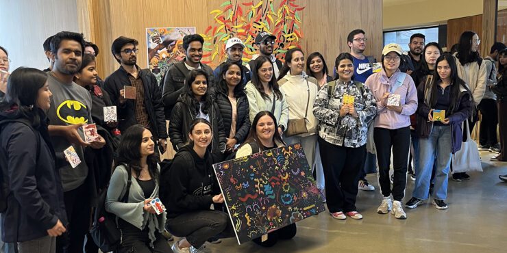 FBL International students take a group photo at Bilya Koort Boodja, holding their collective dot painting.