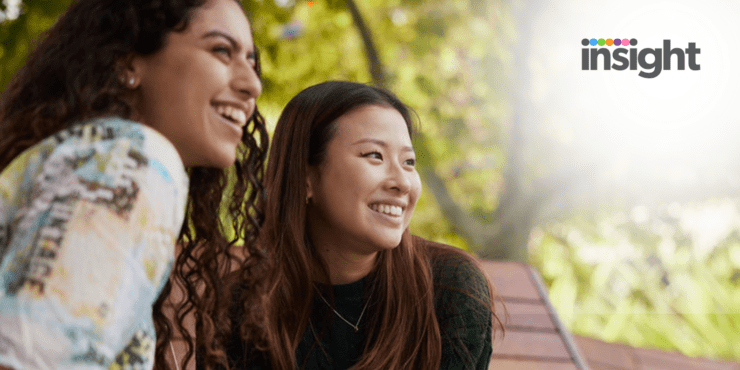 Two students smiling into the distance. The Insight logo is in the top right hand corner.