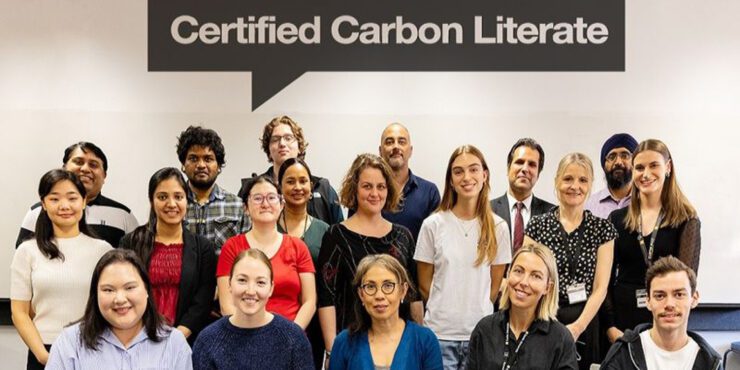 Students who participated in the Carbon Literacy Program standing together for a group photo