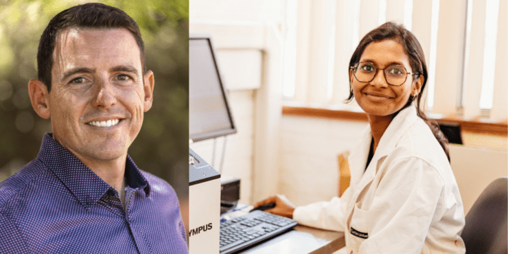 Two researchers pose for the camera.