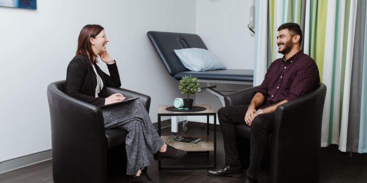 Young female psychology student chats with a client