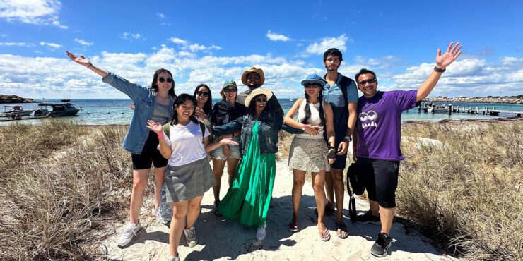 Faculty of Business and Law students smiling for a group photo at Rottnest Isalnd.