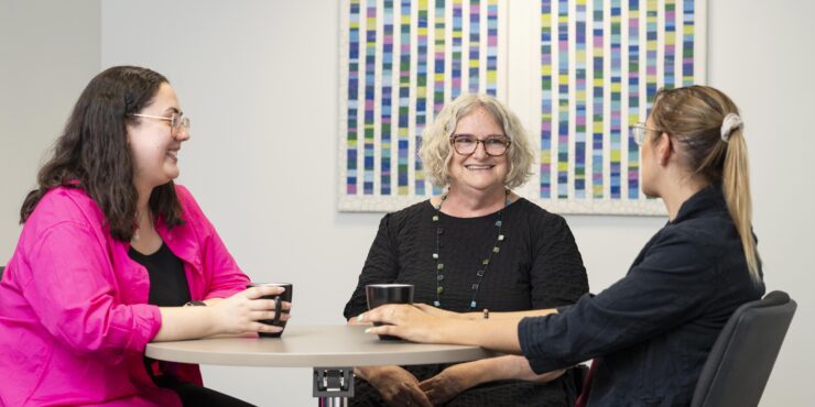 Three female social workers chatting