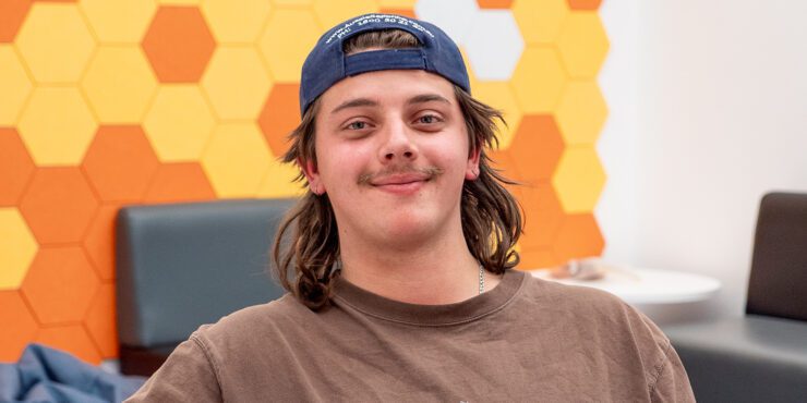 Kim Foster a Geology and Curtin Kalgoorlie student smiles inside the Kalgoorlie Library.