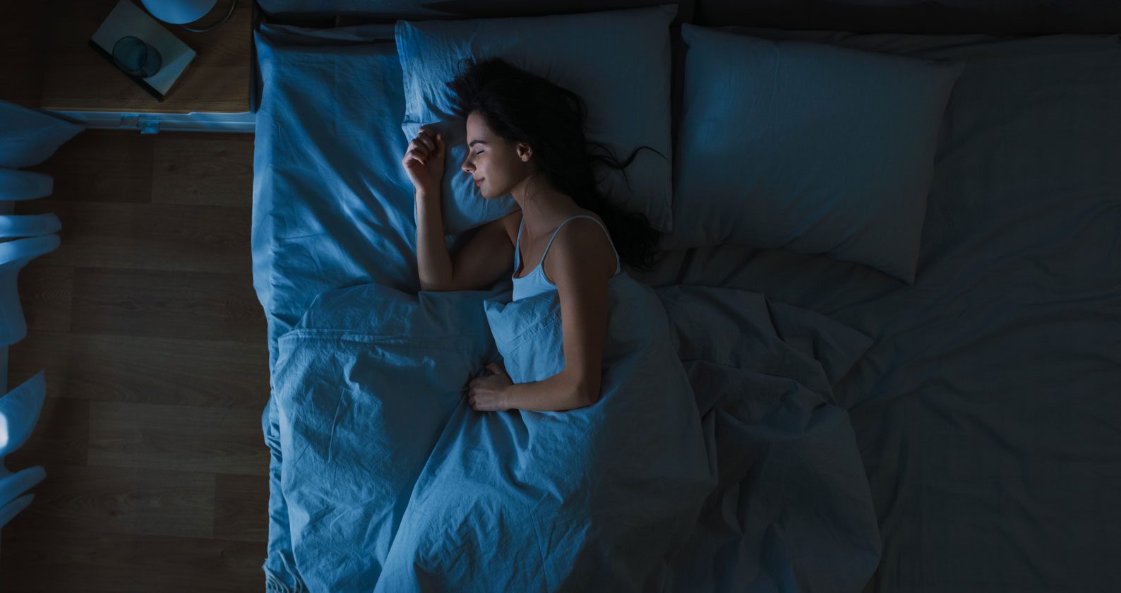 Woman sleeping in a bed,