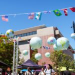 Bunting of flags and inflatable globes.