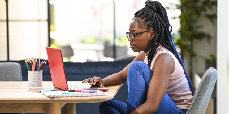 A person working on a laptop.