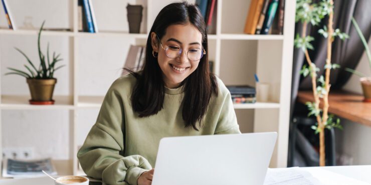 Student studying on a laptop.