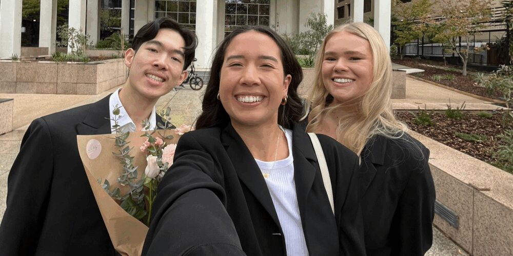 A group of people posing for a selfie.