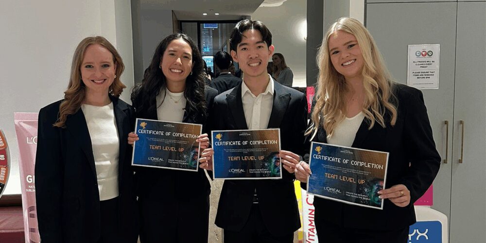 A group of people holding certificates.