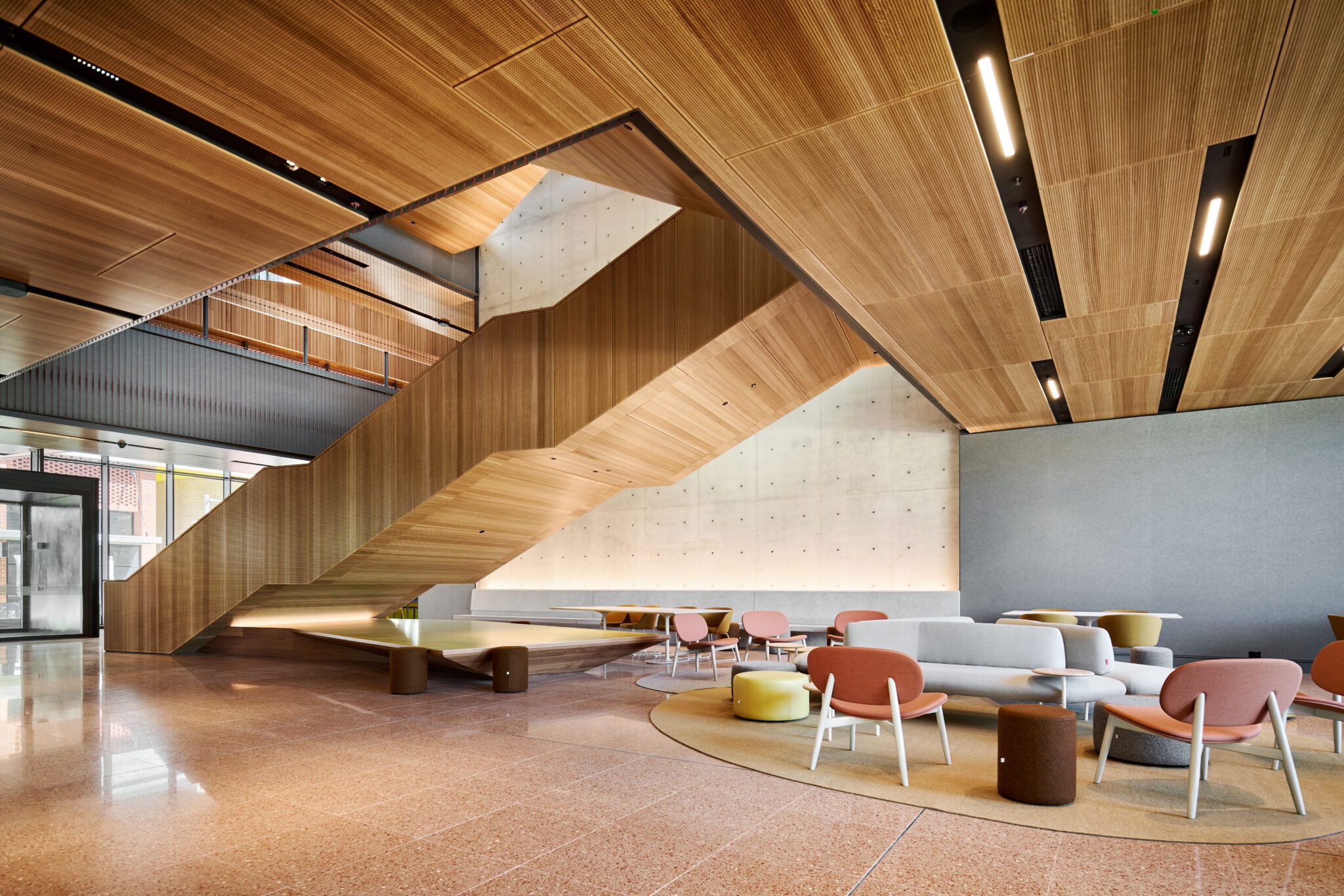 Photograph of inside Curtin's School of Design and the Built Environment, featuring a warm colour pallette.