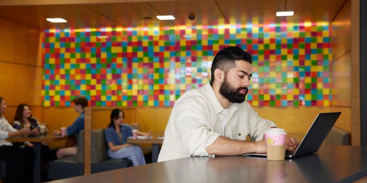 A student working on their laptop.