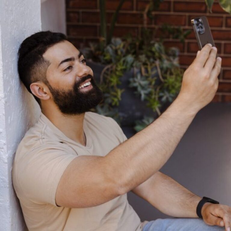 Student holding up his phone