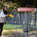 A woman playing frisbee.