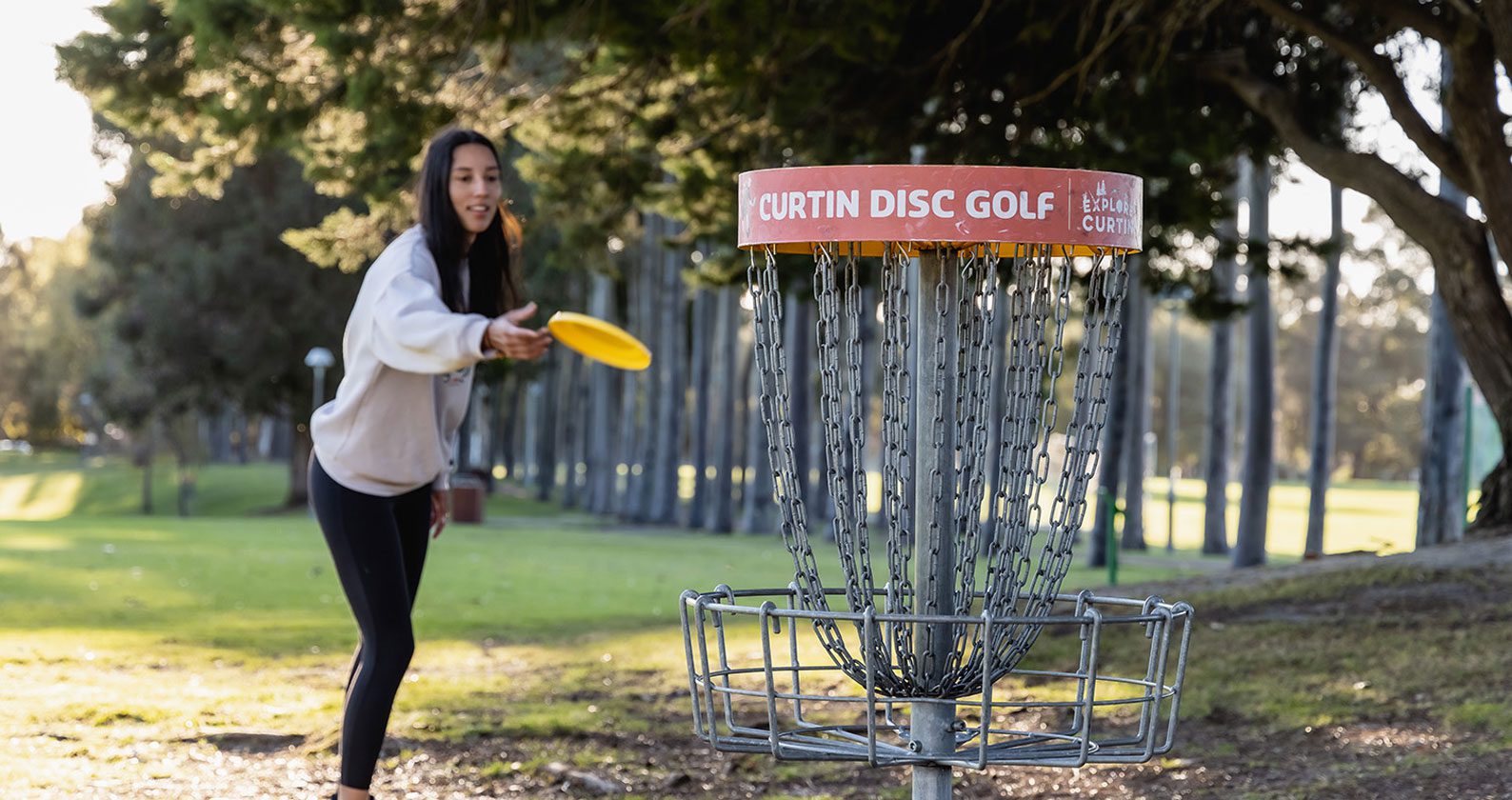 A woman playing frisbee.