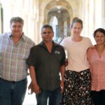 A group of researchers stand together.